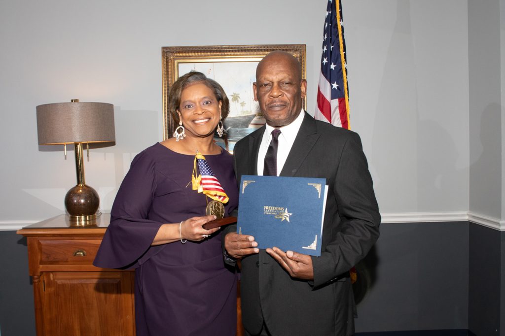 Two winners of the National Award George Washington Medal of Honor posing with their trophy and certificate